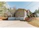 View of home's side and driveway, leading to a spacious two-car garage at 31 Wyngate Ct, Dallas, GA 30157