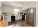 Bright kitchen features white cabinetry, granite countertops, and stainless steel appliances at 31 Wyngate Ct, Dallas, GA 30157
