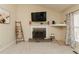 Living room with a fireplace, built-in shelving, and minimalist decor at 31 Wyngate Ct, Dallas, GA 30157