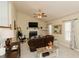 Cozy living room features a fireplace, TV, ceiling fan, and neutral tones for relaxation at 31 Wyngate Ct, Dallas, GA 30157