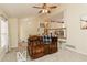 Well-lit living room with plush seating and a view of the staircase at 31 Wyngate Ct, Dallas, GA 30157