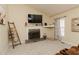 Bright living room with vaulted ceilings, a fireplace, and a wall-mounted television at 31 Wyngate Ct, Dallas, GA 30157