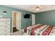 Main bedroom with a unique ceiling, decorative furniture, TV, and bathroom at 31 Wyngate Ct, Dallas, GA 30157