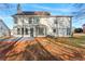 Large backyard with patio and well-maintained lawn at 4275 Azalea Walk, Ellenwood, GA 30294