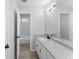 Bright bathroom with granite counters and modern black fixtures at 4275 Azalea Walk, Ellenwood, GA 30294