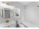 Modern bathroom with updated vanity, tub, and fixtures offers style and comfort at 4275 Azalea Walk, Ellenwood, GA 30294