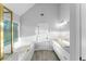 Bathroom boasts a white vanity with granite countertop, large soaking tub and stylish fixtures at 4275 Azalea Walk, Ellenwood, GA 30294