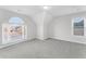 Bright bedroom with arched window and plush carpeting at 4275 Azalea Walk, Ellenwood, GA 30294