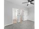 Bedroom features a ceiling fan and an ensuite bathroom at 4275 Azalea Walk, Ellenwood, GA 30294