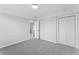 Bedroom featuring plush carpet and closet space offers style and convenience at 4275 Azalea Walk, Ellenwood, GA 30294