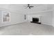 Large bedroom with fireplace, carpeted floors, and ample natural light at 4275 Azalea Walk, Ellenwood, GA 30294