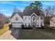 Beautiful two-story home with a manicured lawn, attached two-car garage, and striking curb appeal at 4275 Azalea Walk, Ellenwood, GA 30294