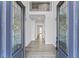 Stunning foyer with decorative glass doors, wood-look floors and wrought iron railing at 4275 Azalea Walk, Ellenwood, GA 30294