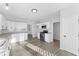 Updated kitchen featuring stainless steel appliances, white cabinets, and modern hardware at 4275 Azalea Walk, Ellenwood, GA 30294