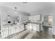 Bright kitchen featuring white cabinets, granite countertops, and stainless steel appliances at 4275 Azalea Walk, Ellenwood, GA 30294