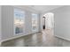 Bright living room featuring new floors, large windows, and elegant trim details throughout at 4275 Azalea Walk, Ellenwood, GA 30294