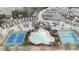 Aerial shot showcasing community amenities including pool, clubhouse, tennis courts, and townhome neighborhood at 5316 Radford Loop, Fairburn, GA 30213