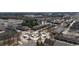 An aerial view shows the community's design with a central roundabout, pond, and winding streets lined with townhomes at 5316 Radford Loop, Fairburn, GA 30213