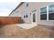 A small back yard with a wood fence and a concrete patio at 5316 Radford Loop, Fairburn, GA 30213