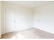 Comfortable bedroom with soft carpet, neutral walls, and white doors, creating a cozy retreat at 5316 Radford Loop, Fairburn, GA 30213