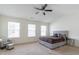 Bright bedroom with carpet, a ceiling fan, and large windows for natural light at 5316 Radford Loop, Fairburn, GA 30213