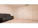 Cozy bonus room with neutral carpeting, gray recliner sofa and plenty of natural light at 5316 Radford Loop, Fairburn, GA 30213