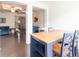 View of the dining area featuring dark floors, a wood table, and access to the living room at 5316 Radford Loop, Fairburn, GA 30213