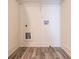 Functional laundry room with utility connections and a wire shelf for organized storage solutions at 5316 Radford Loop, Fairburn, GA 30213