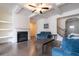 Spacious living room featuring dark floors, fireplace, and coffered ceilings at 5316 Radford Loop, Fairburn, GA 30213