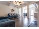 Open-concept living room featuring dark floors, fireplace, and view to the dining area at 5316 Radford Loop, Fairburn, GA 30213