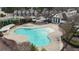 Aerial view of community pool, cabana, and clubhouse; perfect for relaxation and recreation at 5316 Radford Loop, Fairburn, GA 30213