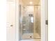 Bathroom shower with elegant tile and a built-in niche for storage at 5316 Radford Loop, Fairburn, GA 30213