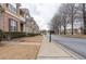 Neighborhood street view with sidewalks and well-maintained landscaping at 5316 Radford Loop, Fairburn, GA 30213