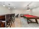 Basement featuring a wet bar, seating, and pool table at 644 Herring Rd, Grayson, GA 30017