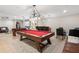Entertainer's basement with a pool table, seating area, bar, and projection screen offering endless entertainment possibilities at 644 Herring Rd, Grayson, GA 30017