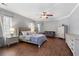 Main bedroom features hardwood floors, light gray walls, and a seating area at 644 Herring Rd, Grayson, GA 30017