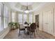 Cozy breakfast nook with natural light, round table and chairs, and detailed ceiling at 644 Herring Rd, Grayson, GA 30017