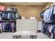 Walk-in closet with custom shelving, clothing racks, and ample storage space at 644 Herring Rd, Grayson, GA 30017