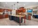 Spacious kitchen with a large island, granite countertops, and stainless steel appliances at 644 Herring Rd, Grayson, GA 30017