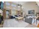 Inviting living room with tall windows, a fireplace, and comfortable blue sofas at 644 Herring Rd, Grayson, GA 30017
