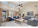Spacious living room with tall windows, comfortable seating, and neutral decor at 644 Herring Rd, Grayson, GA 30017