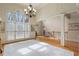 Elegant living room with lots of natural light, hardwood floors, and an open layout at 644 Herring Rd, Grayson, GA 30017