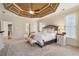 Bedroom with tray ceiling, carpet, and ensuite bathroom at 644 Herring Rd, Grayson, GA 30017