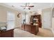 Spacious home office featuring a large desk, built-in shelving, and natural light at 644 Herring Rd, Grayson, GA 30017