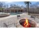 Relaxing outdoor oasis featuring a pool, hot tub, fire pit, and ample seating for entertaining amidst a private setting at 644 Herring Rd, Grayson, GA 30017