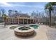 Resort-style pool with an attached spa, lush landscaping, and ample patio space for lounging and dining at 644 Herring Rd, Grayson, GA 30017