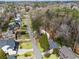 Residential street with well-manicured lawns and mature trees, showcasing the neighborhood's charm and curb appeal at 2711 Winding Ne Ln, Brookhaven, GA 30319