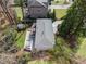 Aerial shot showing roof, backyard patio, and surrounding landscape in a serene setting at 2711 Winding Ne Ln, Brookhaven, GA 30319