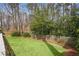 Well-maintained backyard with lush green lawn and a wooden fence, perfect for outdoor enjoyment at 2711 Winding Ne Ln, Brookhaven, GA 30319