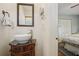 Elegant bathroom featuring a vanity sink with wooden cabinets, and view into the bedroom at 2711 Winding Ne Ln, Brookhaven, GA 30319